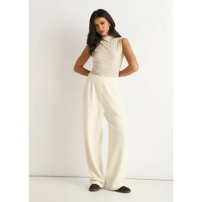 Cremefarbene Strickhose mit weitem Bein zum Hineinschlüpfen