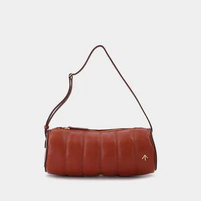 Gepolsterte Zylindertasche aus rotem Leder